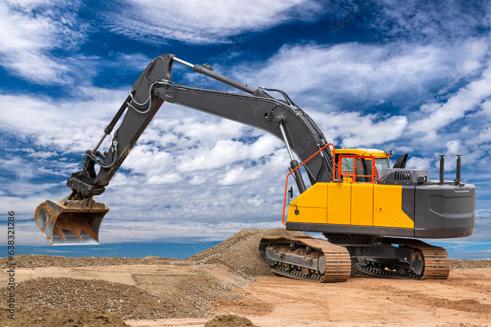 excavator is in work and digging at construction site excavator is in work and digging at construction site