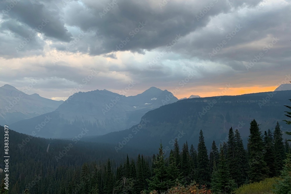 sunset in the stormy, cloudy mountains 