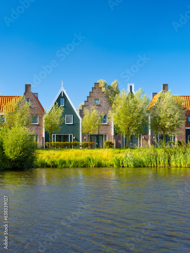 A row of houses in the Netherlands. Old buildings. Architecture and construction. Photo for background and wallpaper.