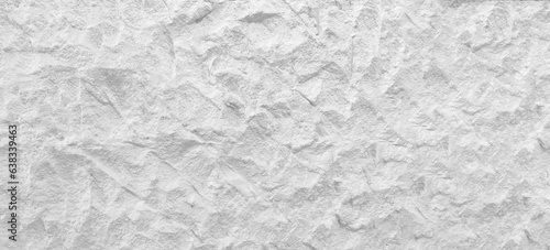 White wall surface of the white stone texture rough, gray tone. Use this for wallpaper or background image rock backdrop. There is a blank space for text.