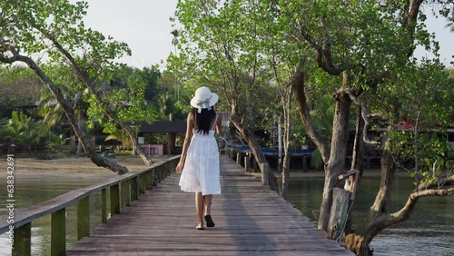 Wallpaper Mural Woman Seen From Behind While Walking On Pier Torontodigital.ca