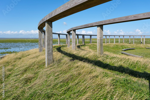 View on the Terp fan de Takomst. An initiative of the village of Blije, Sense of Place and other parties to emphasize the long connection with the Wadden Sea.	 photo