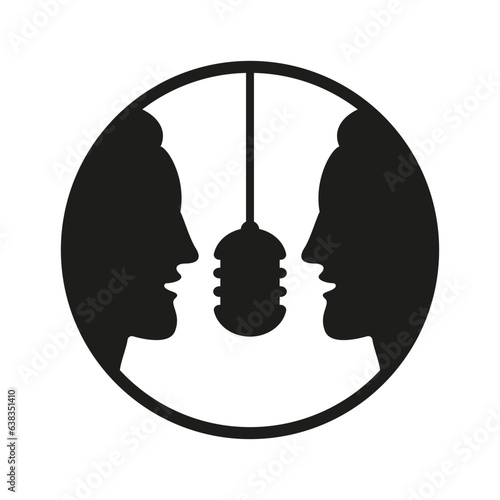 Two men talking into a microphone.