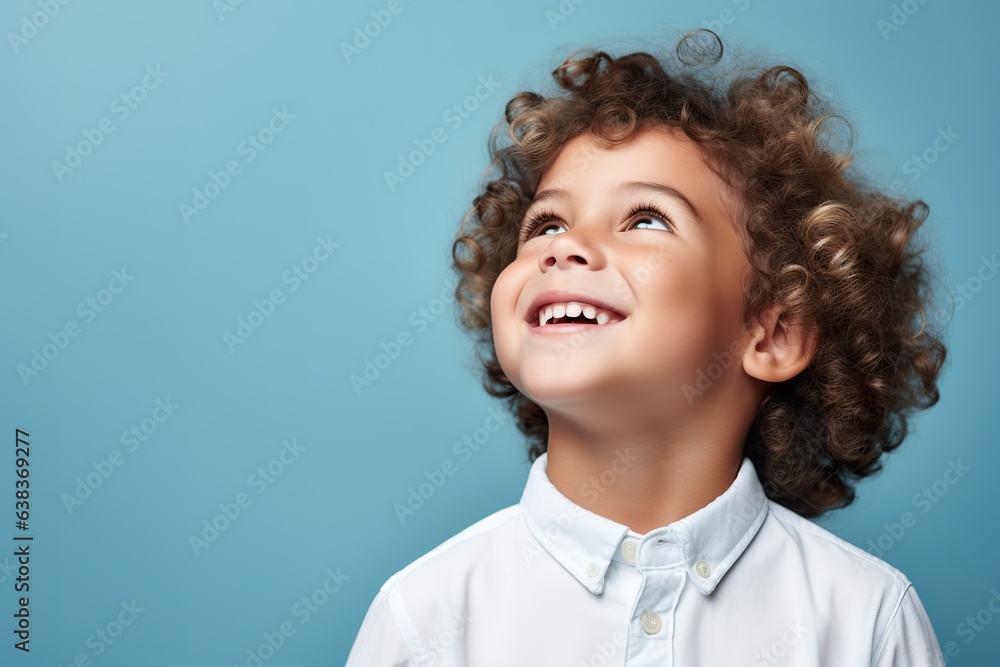 Youthful Charm: Boy's Portrait on Blue Youthful Charm: Boy's Portrait on Blue