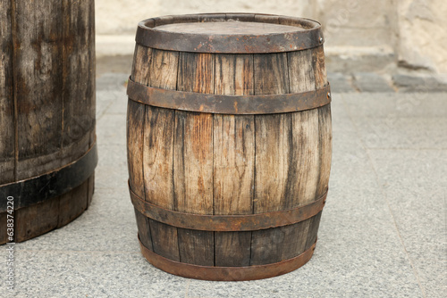 Traditional wooden barrel on street outdoors. Wine making