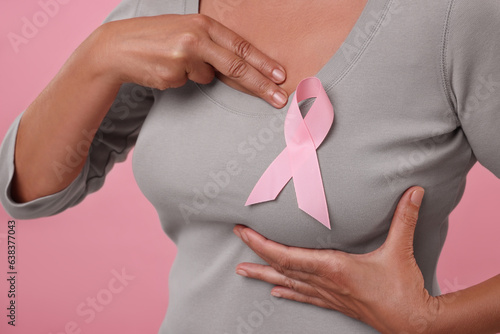 Wallpaper Mural Woman with pink ribbon on color background, closeup. Breast cancer awareness Torontodigital.ca