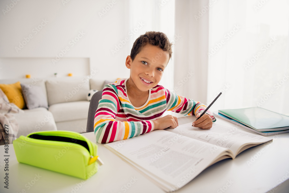Photo of clever young preschool charming little boy write pencil homework dont like studying school enjoy remote courses isolated indoors Photo of clever young preschool charming little boy write pencil homework dont like studying school enjoy remote courses isolated indoors