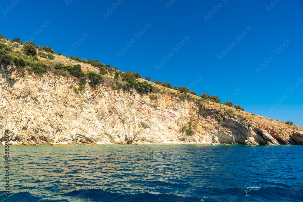  Beautiful Gremina beach seen from the boat on the Albanian riviera near Sarande, turquoise sea water