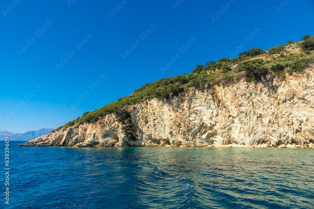  Beautiful Gremina beach seen from the boat on the Albanian riviera near Sarande, turquoise sea water