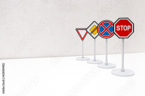 road signs in a row on a light background with copy space