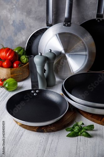 pots and pans in the kitchen, on a gray background