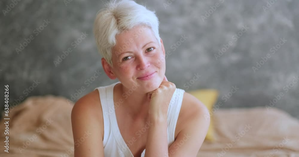 Portrait mature grey haired woman middle aged at home, real woman smiling , looking at camera. Portrait mature grey haired woman middle aged at home, real woman smiling , looking at camera.