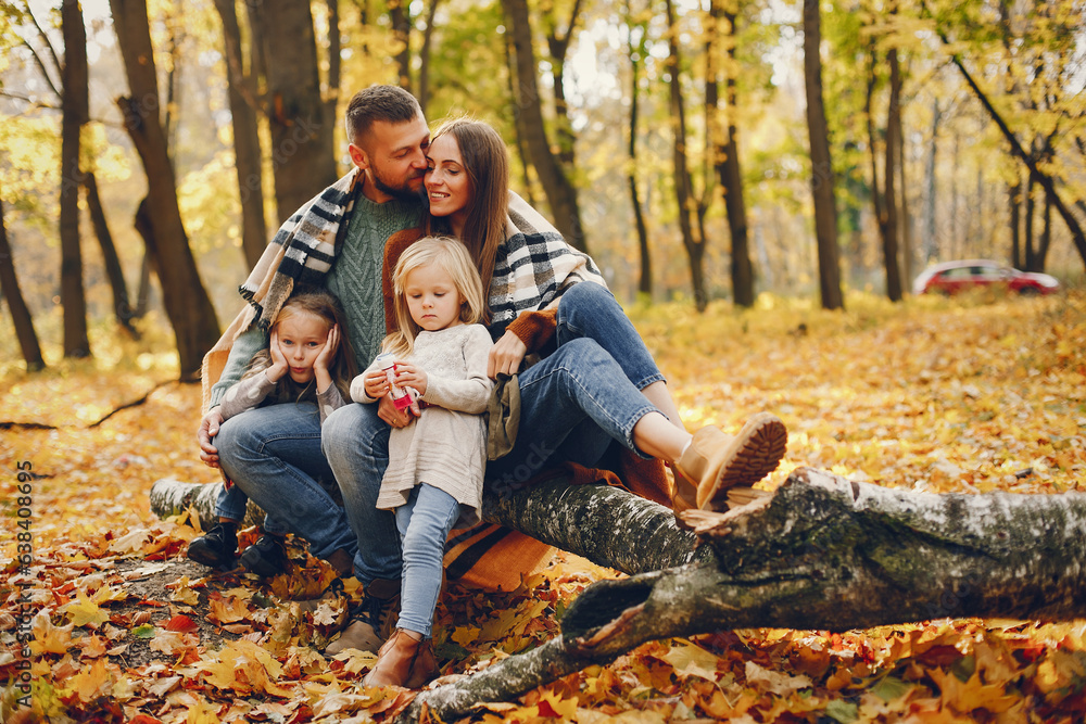 Family with cute kids in a autumn park Family with cute kids in a autumn park