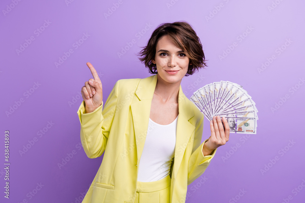 Photo advert legal lottery of funny girl brown hair wear yellow suit hold income point finger mockup isolated on purple color background Photo advert legal lottery of funny girl brown hair wear yellow suit hold income point finger mockup isolated on purple color background