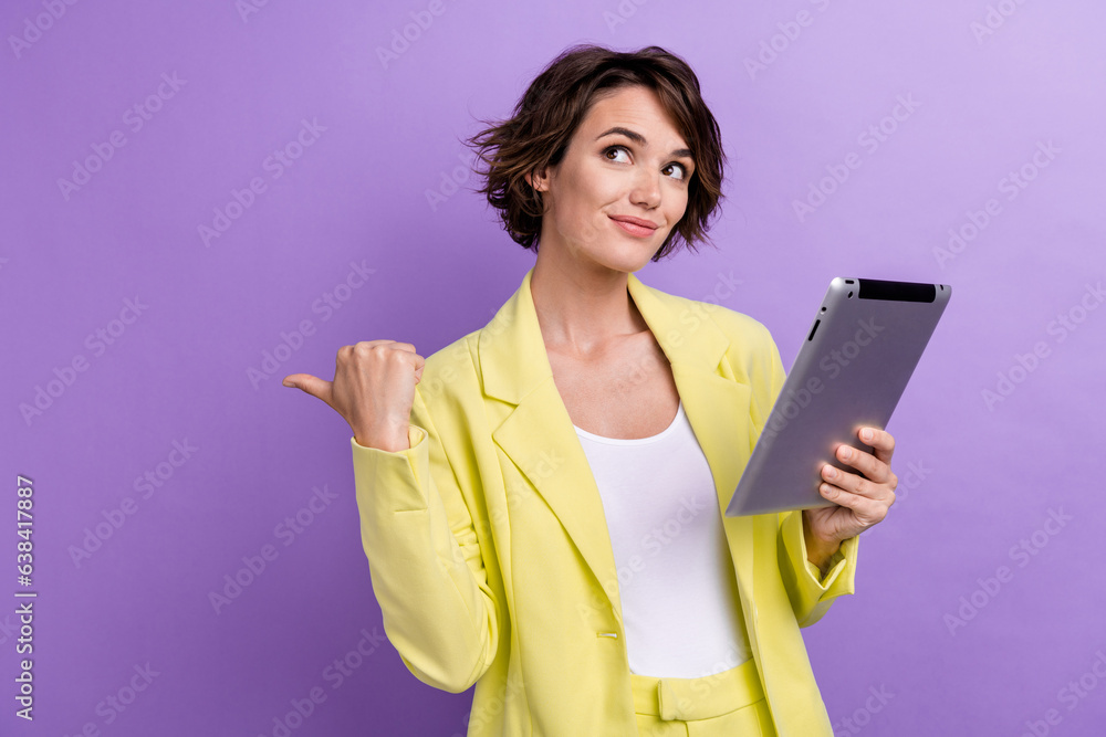 Photo of business partner woman trendy lime stylish suit holding web gadget tablet direct finger mockup isolated on violet color background Photo of business partner woman trendy lime stylish suit holding web gadget tablet direct finger mockup isolated on violet color background