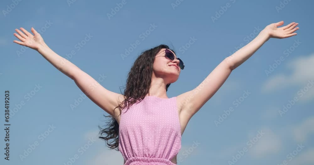 Happy relaxed woman breathing fresh air raising arms over blue sky at summer, Dreaming, freedom and traveling concept. Happy relaxed woman breathing fresh air raising arms over blue sky at summer, Dreaming, freedom and traveling concept.