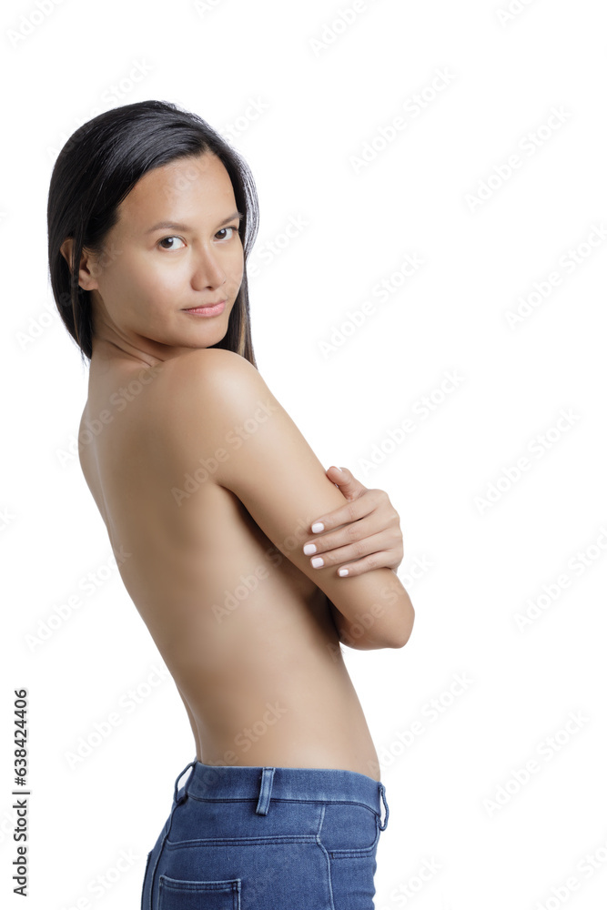 Young Asian Woman posing topless using hands to cover breast Young Asian Woman posing topless using hands to cover breast