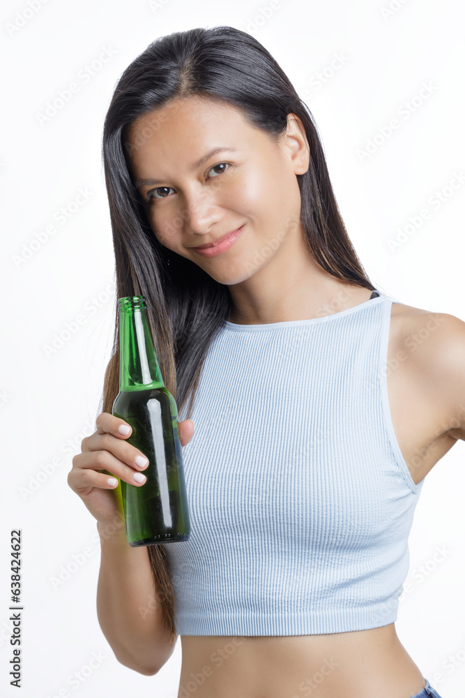Asian American celebrating while holding a bottle of delicious beer Asian American celebrating while holding a bottle of delicious beer