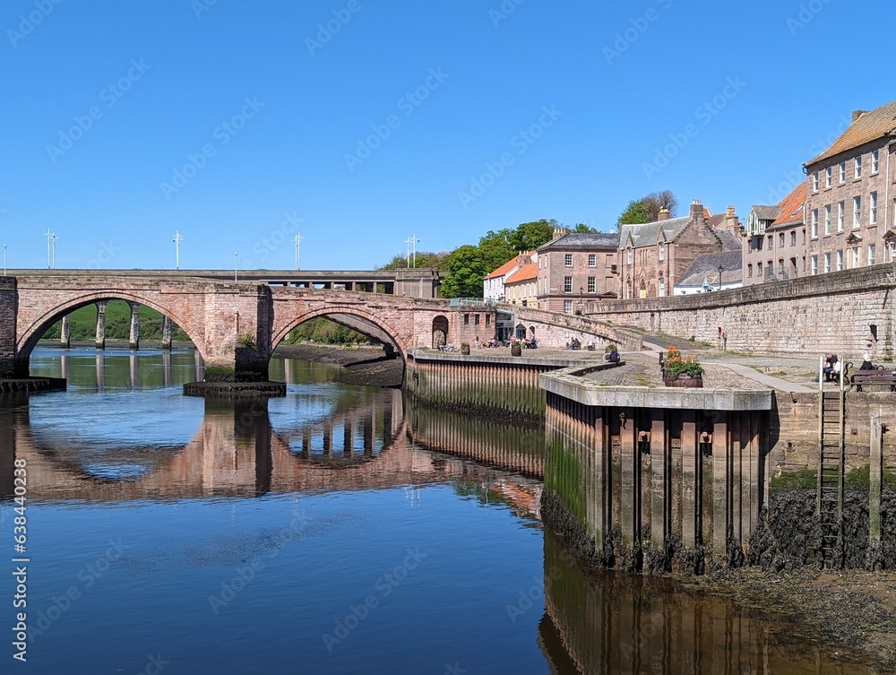 Houses and other buildings lining the bank of the River Tweed at Berwick-upon Tweed in Northumberland, England, UK.