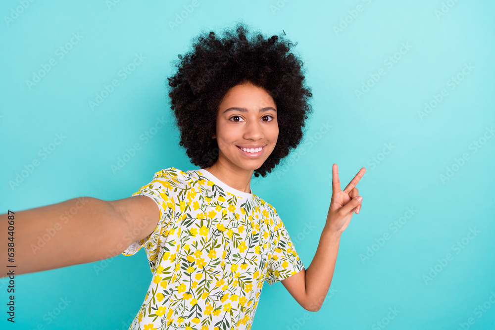 Closeup selfie cadre photo of optimistic blogging funny girl kid fingers gesture v sign greetings isolated on aquamarine color background Closeup selfie cadre photo of optimistic blogging funny girl kid fingers gesture v sign greetings isolated on aquamarine color background