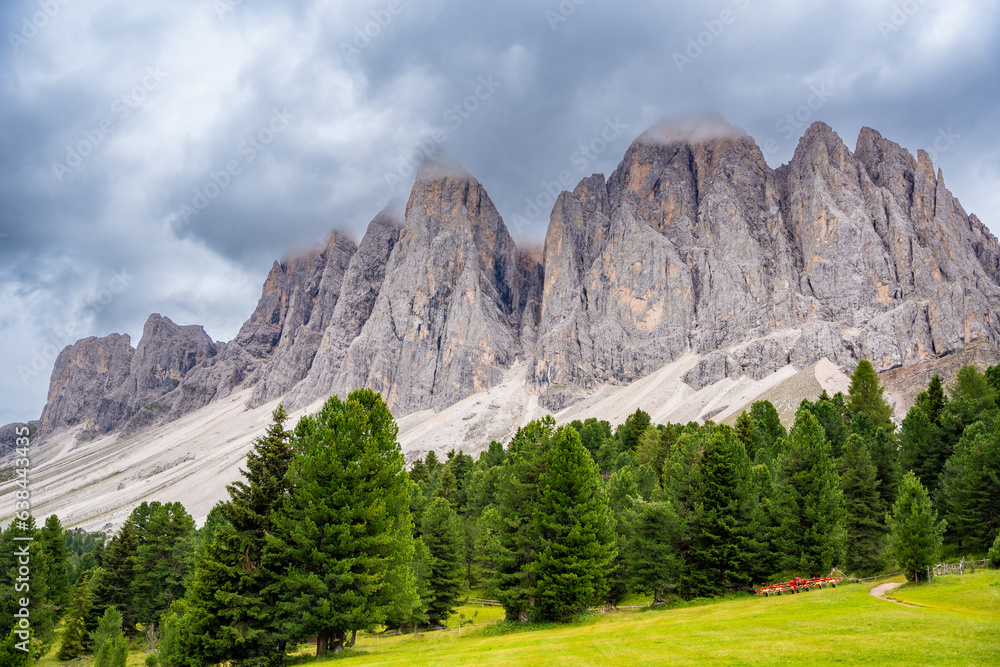 Dolomite landscape in Puez Odle Nature Park - view from alpine plateau with green meadows, Italy