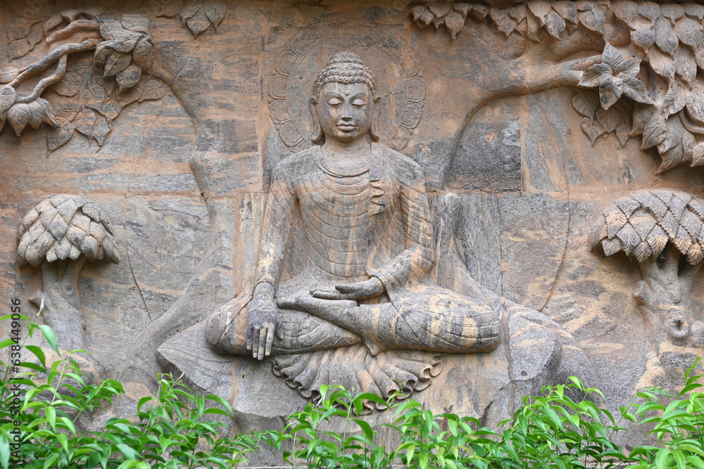 Stone statue of buddha at Mahabodhi Temple Complex in Bodh Gaya, India.Buddha sculpture tells the story of the Buddha's history.