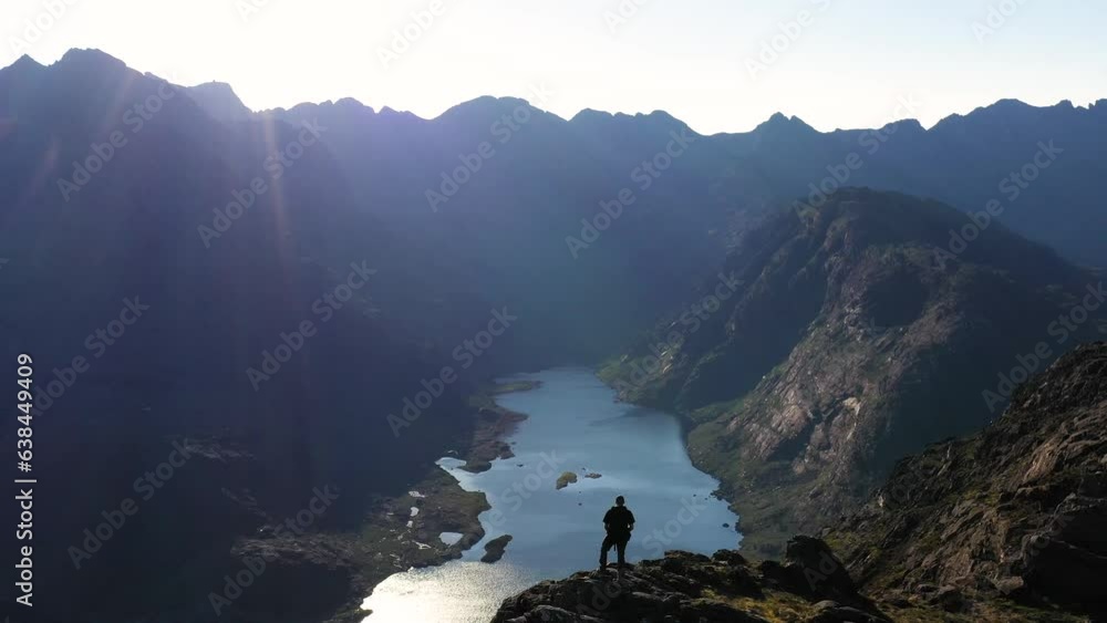 Aerial view of the Jagged Mountains, Lochs and Sea on the Isle of Skye, Scotland UK on a Sunny Day. Hiking and camping in the Cuillin Mountains. Aerial view of the Jagged Mountains, Lochs and Sea on the Isle of Skye, Scotland UK on a Sunny Day. Hiking and camping in the Cuillin Mountains.