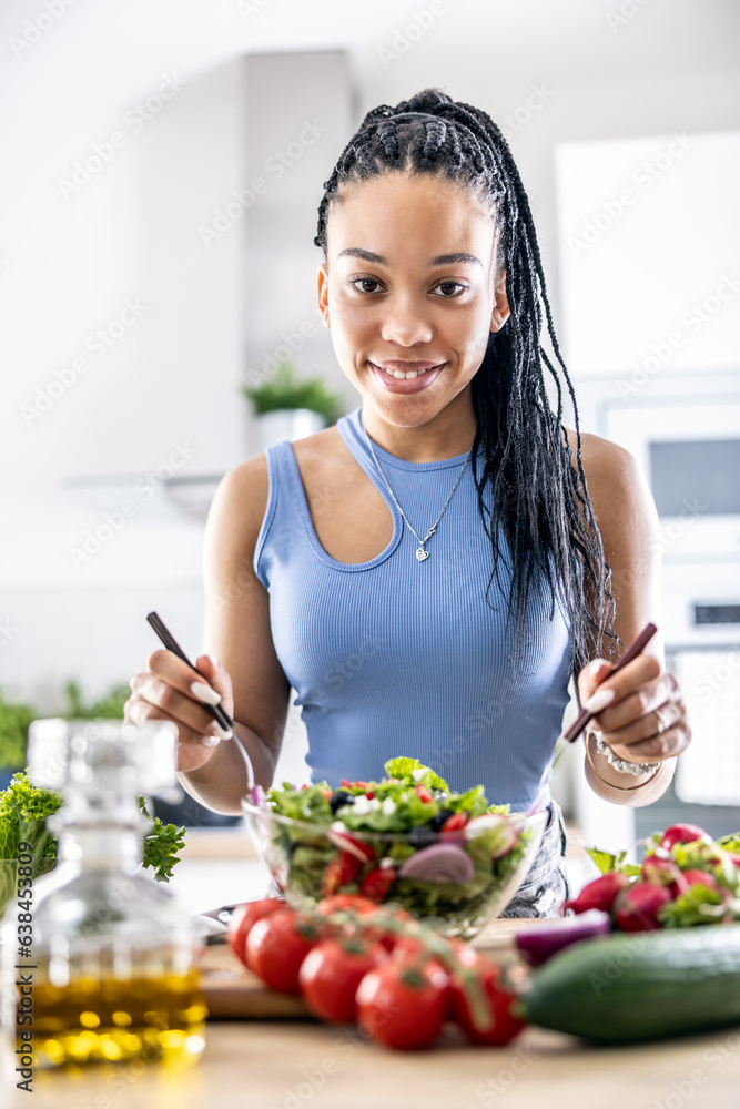 Female hands mixing a healthy spring salad made from various ingredients. Concept of healthy lifestyle Female hands mixing a healthy spring salad made from various ingredients. Concept of healthy lifestyle