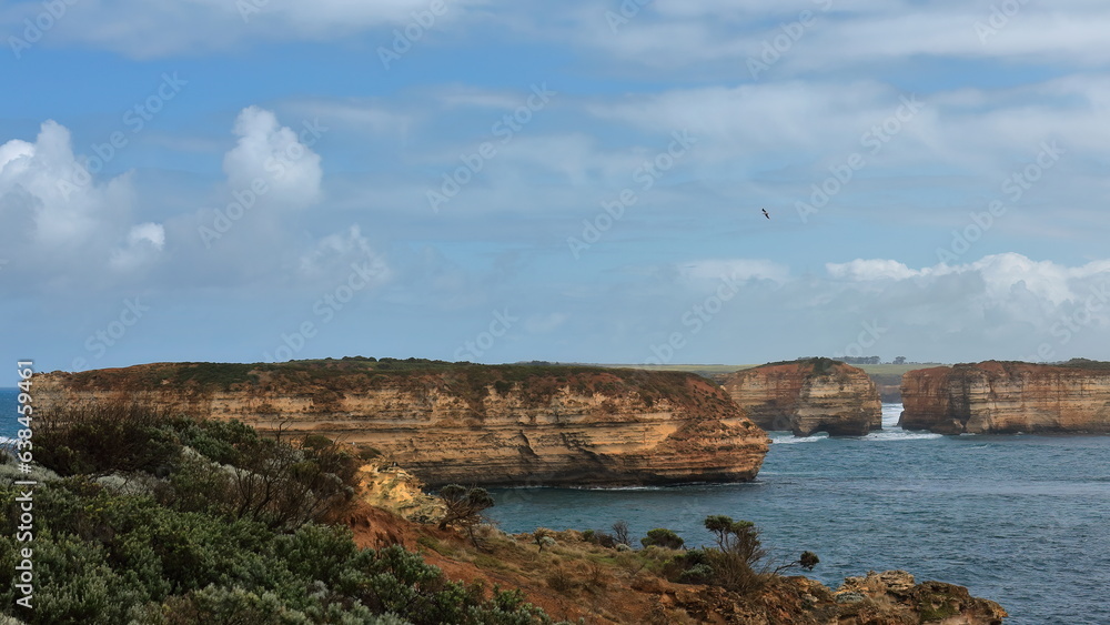 Wave-beaten rock stacks and pillars off the Bay of Islands Coastal Park. Peterborough-Australia-841