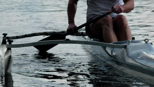  Canoeing competition training coaching workout a outrigger canoe boat sport. Single rowing of men in large water