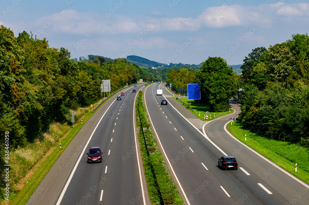 Fototapeta premium Expressway in germany with cars on it and signs