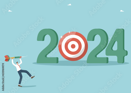 Setting business target for new year 2024, developing strategy or plan to achieve financial goals or results in work, striving or motivating for success in new year, man throws dart at board for 2024.