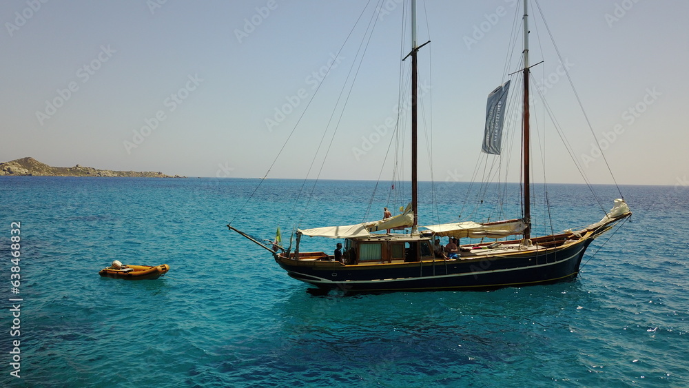 Yacht, sailing in Greece and summer on ocean holiday, relax in freedom and peace in nature on blue water. Boat vacation, travel in sun and tropical cruise on sea adventure to with island beach fun.