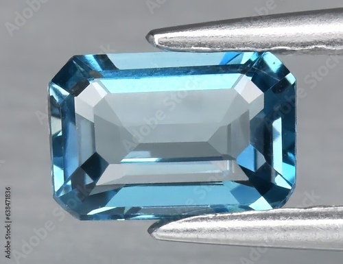 Papier peint Natural gemstone blue topaz on a gray background