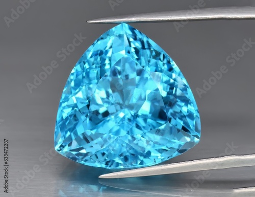 Cuadro en lienzo Natural gemstone blue topaz on a gray background