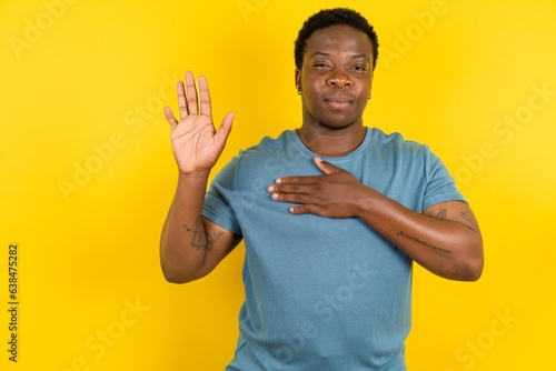 MODEL Swearing with hand on chest and open palm, making a loyalty promise oath