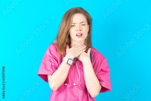 young beautiful red haired doctor woman shouting suffocate because painful strangle. Health problem. Asphyxiate and suicide concept.