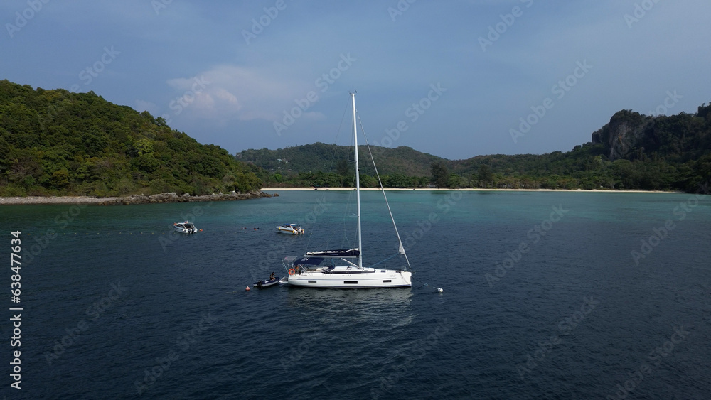 Sailing yacht in the sea on the background of the horizon, drone view of a sailing yacht in the province of Krabi Sailing yacht in the sea on the background of the horizon, drone view of a sailing yacht in the province of Krabi