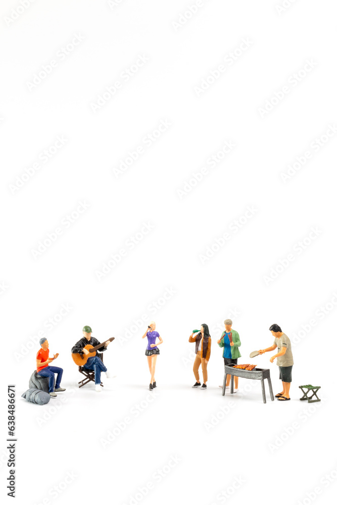 Miniature people are making barbeque, drinking beverages isolated on white background Miniature people are making barbeque, drinking beverages isolated on white background