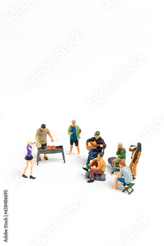 Miniature people are making barbeque  drinking beverages isolated on white background