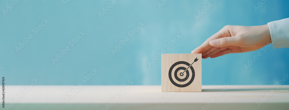 Goal and planning concept, Hand holding wooden block with target aiming dart board, Business achievement objective goal and project progress growth value processing marketing financial, Reach target - obrazy, fototapety, plakaty 