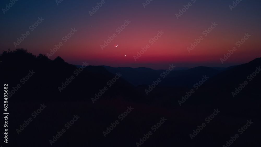 Silhouette of a countryside with Milky Way stars, planets and crescent Moon. Silhouette of a countryside with Milky Way stars, planets and crescent Moon.