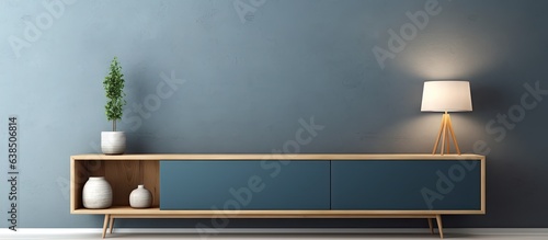 Fototapeta Naklejka Na Ścianę i Meble -  Modern empty room with dark blue wall TV cabinet