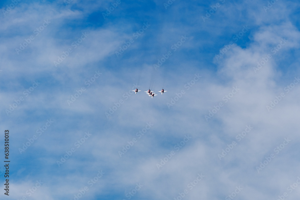 Obraz premium Patrouille Suisse doing aerobatics at Swiss Army exhibition at training ground of Swiss City of Kloten on a sunny summer day. Photo taken August 18th, 2023, Zurich Kloten, Switzerland.