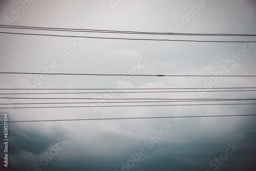 Electric wires on the background of the sky and clouds