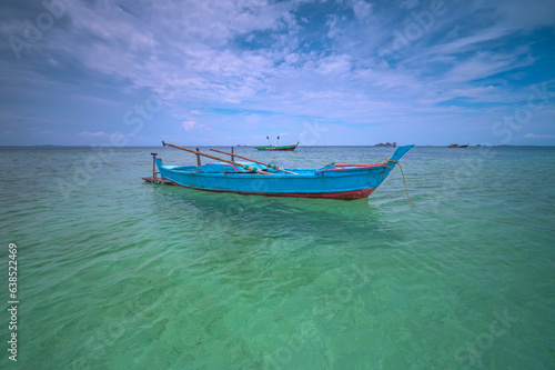 Fishing boat in the sea at Bintan Island, Indonesia © Nurwijaya