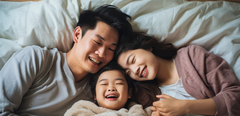 Diverse Asian Family Enjoying Each Other's Company on Bed, Top View
