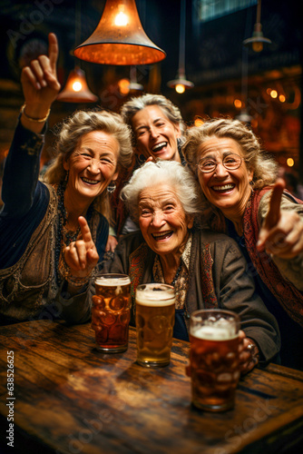 A group of happy, smiling age-old friends are drinking beer in a restaurant bar, having fun and chatting. Active lifestyle in old age