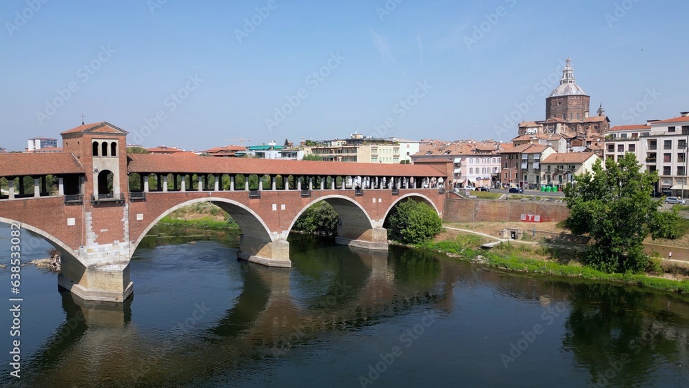 Europe, Italy , Pavia - Drone aerial view of Pavia City in Lombardy with Ponte Coperto (  covered bridge ) on the Ticino and Po' river and during drought and summer aridity 