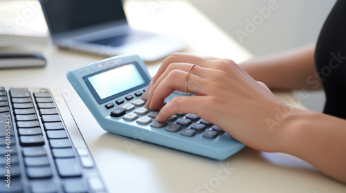 Woman does calculations on a calculator.